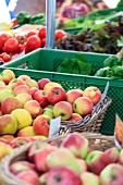 Apples in basket and boxes at organic market, Chamissoplatz, Kreuzberg, Berlin