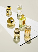 Various bottles of perfume compiled on white background
