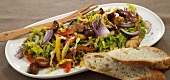 Close-up of pepper salad with mushroom on serving plate