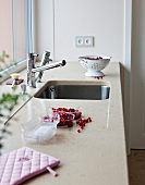 Marble worktop with kitchen faucet and undermount sink in kitchen