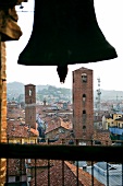 View of Old town through church bell, Alba in Italy