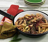 Pasta with chicken liver in pan