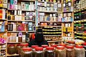 Woman wearing burka selling perfumes in Oman