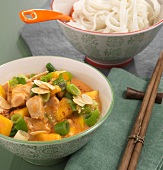 Chicken curry with mango in bowl