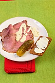 Roast beef with pickles on plate