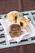 Nut praline cake and vanilla chocolate cake on table cloth