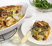 Leek and tomato bake in serving dish