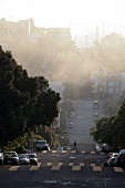 Hilly street with fog at morning, San Francisco, California, USA