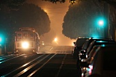 Cable car on illuminated road at night in San Francisco, California, USA