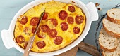 Cheese frittata with tomatoes in serving dish
