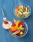 Two types of fruit salad in bowls, overhead view
