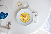 White asparagus salad with oranges on plate
