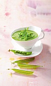 Soup with beans, peas and balsamic in bowl
