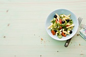 Pasta salad with vegetables in bowl