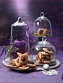 Plates of pecan nut biscuits under glass cloches