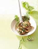 Veal Cutlets with chestnut mushrooms and yarrow in bowl