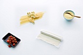 Four different Italian ingredients on white background