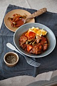 Braised lamb with capers, sweet potatoes and tagliatelle