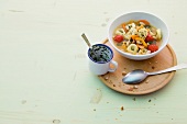 Tortellini and vegetable stew in bowl