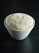 Fermented dough in bowl for preparing bread, step 5