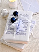 Christmas gifts wrapped in white packing paper
