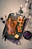 Roasted goose with cranberry, red cabbage and fennel dumplings on tray