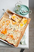 Mango tray bake with courgettes and a coconut topping