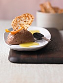 Chocolate orange mousse with orange and cardamom hip on plate