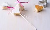 Cake pops in heart shape with white lemon icing