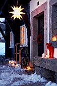 Entrance area for entrance to Tudor cottage with winter decorations