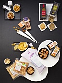 Chips, nuts and other snacks, overhead view
