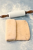 Rolled dough with butter being folded while preparing pastry, step 3