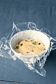 Plastic foil on bowl with chelsea bun