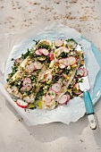 Steamed wurzfisch with radish on baking paper