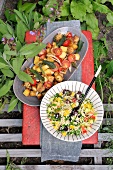 Couscous salad with tomato, sage leaves and bread salad
