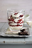 Cranberry with cream and chocolate in glass