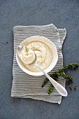 Mustard cream with pepper in bowl