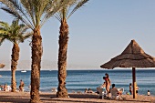 Tourist at beach near Red Sea, Eilat, Israel