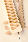 Dough cut in shapes for preparation of mutzen almonds, step 1
