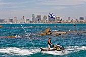 Man riding jet ski in Mediterranean Sea, Tel Aviv, Israel