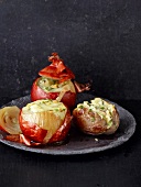 Close-up of three stuffed vegetables on plate