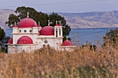 View of Church Seven Apostles with sea in background in Capernaum, Galilee, Israel
