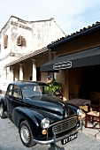 Black vintage ambassador in front of Pedlar's Inn Cafe, Galle Fort, Sri Lanka