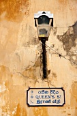 Post lamp on yellow wall, Galle Fort, Sri Lanka