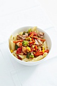 Penne with tuna and vegetables in bowl