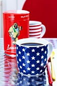 Close-up of cup with stars and stripes with coffee sleeve