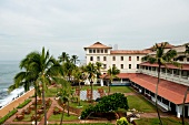View of Galle Face Hotel with palm trees, Colombo, Sri Lanka