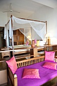 Bedroom with four poster bed in Barberyn Reef Ayurveda Resort, Weligama, Sri Lanka