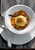 Cheese dumplings with rhubarb compote in bowl