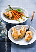 Close-up of lemon carrots with pesto schnitzel and chicken breast in serving bowl